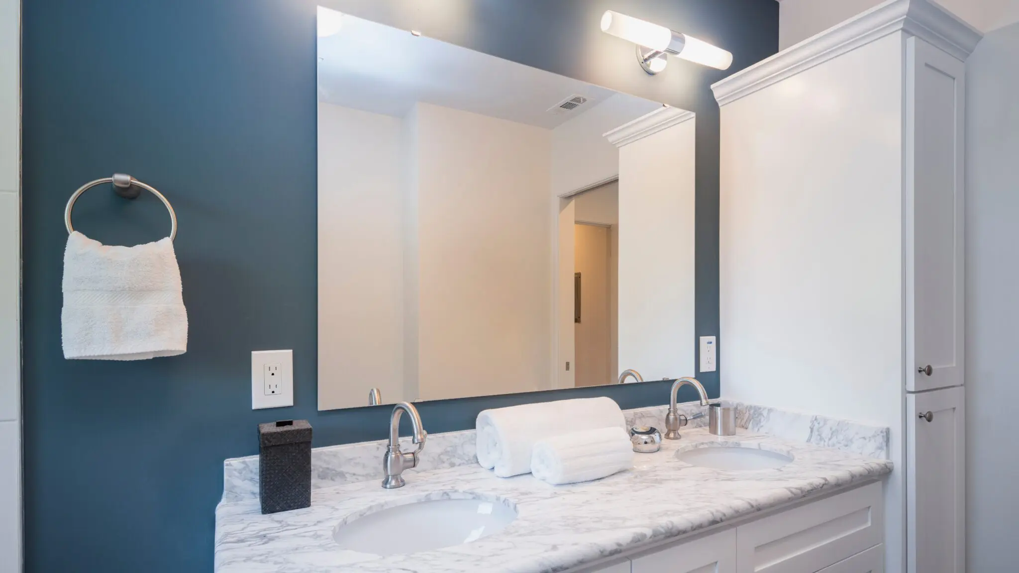 Gorgeous bathroom with white stone countertop and new custom mirror by GoGlass in Dover, DE