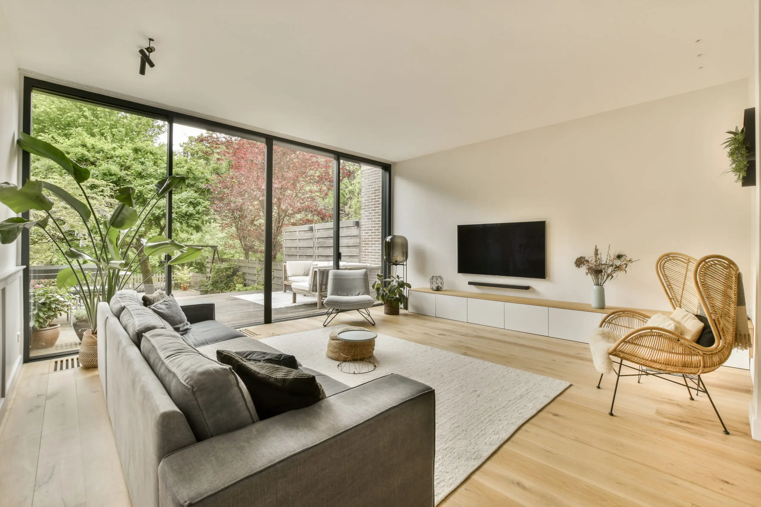 Interior view of a modern living room equipped with large sliding glass doors