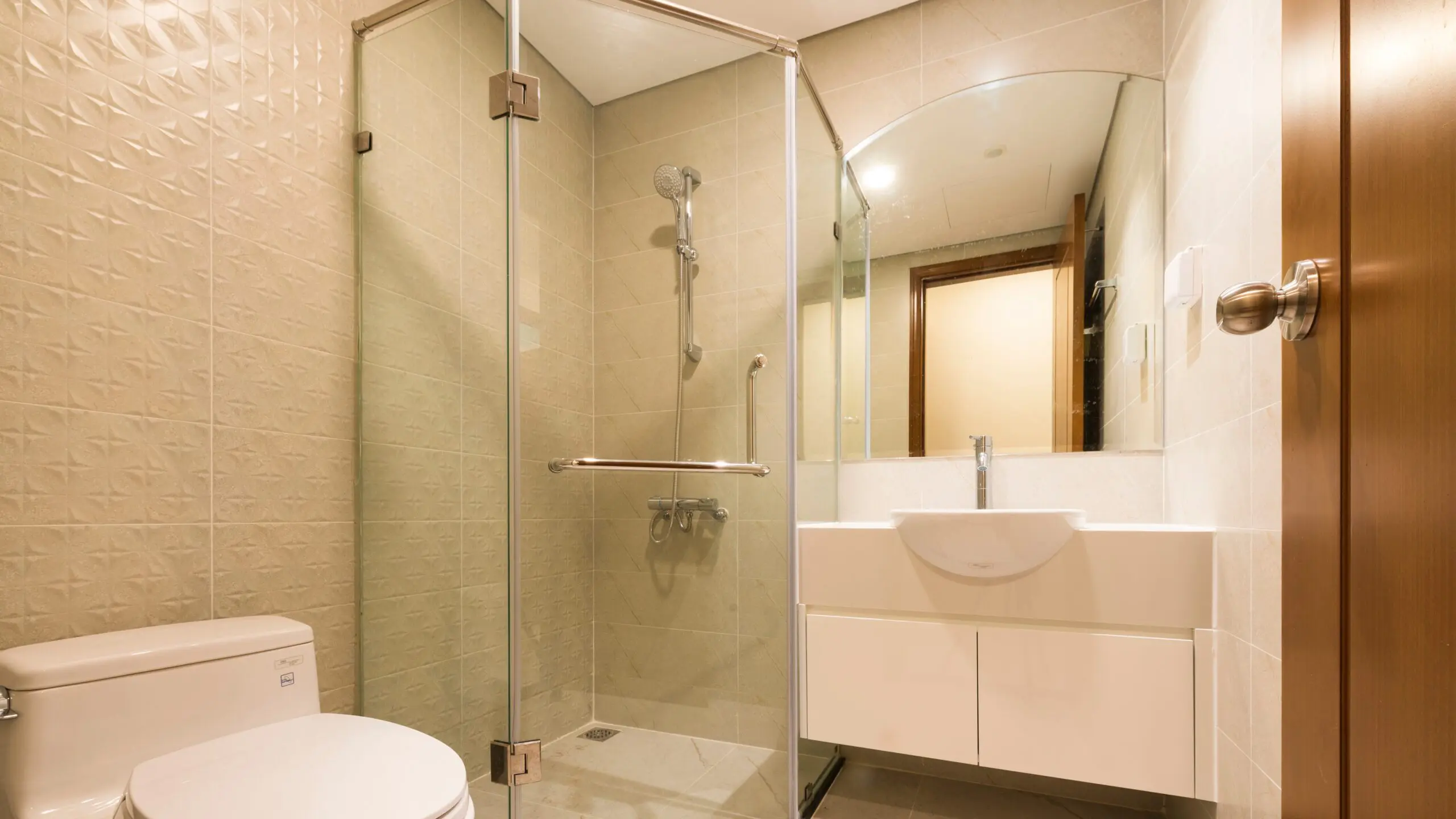 Newly installed corner shower enclosure in luxurious bathroom