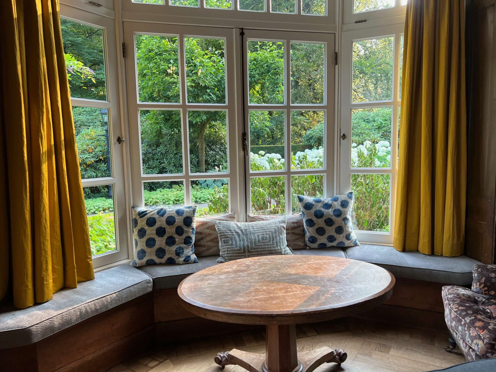 Bay window with seat and trees outside