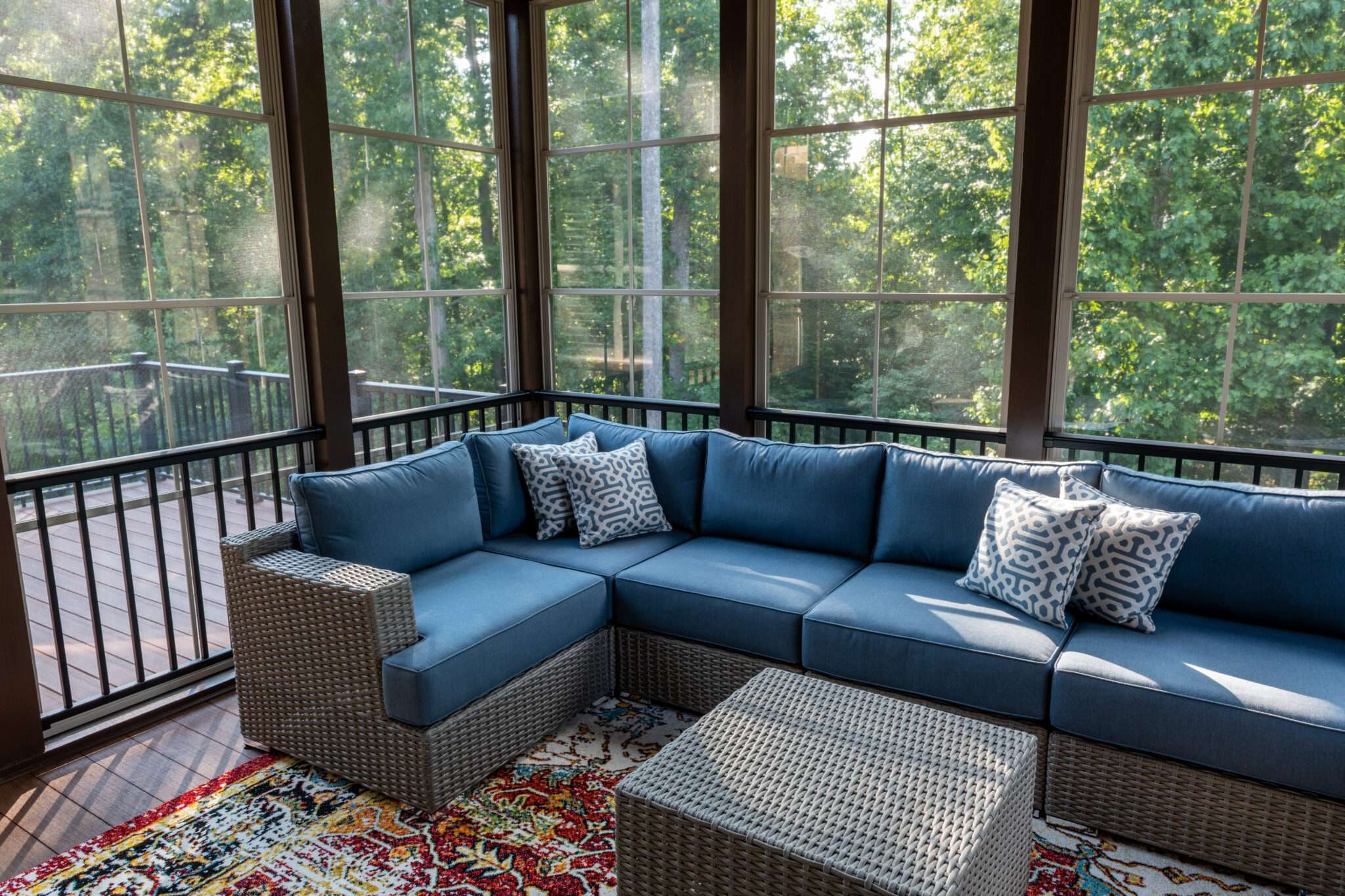 Sunroom with blue patio couch