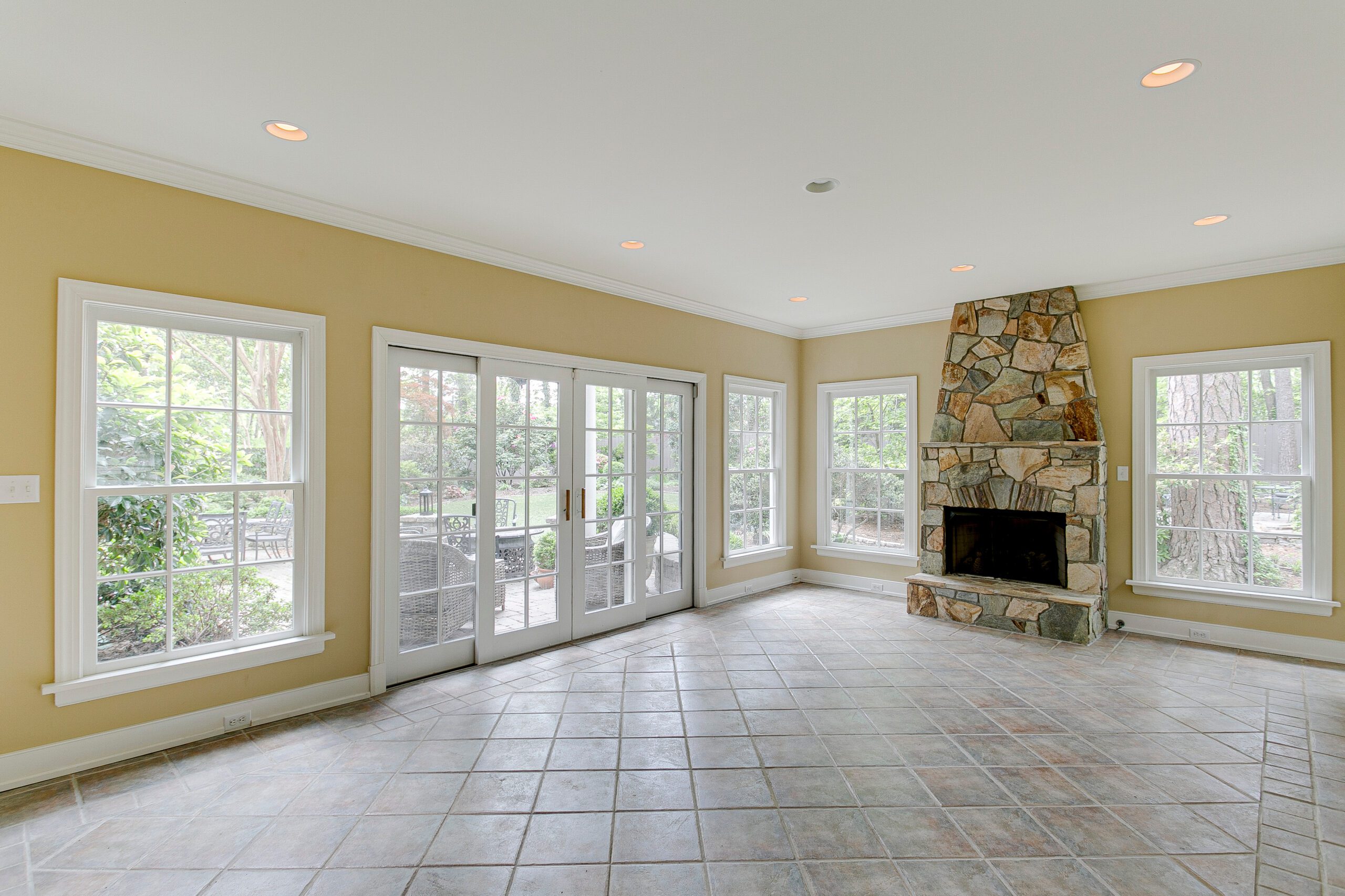 Windows and patio doors in fireplace room