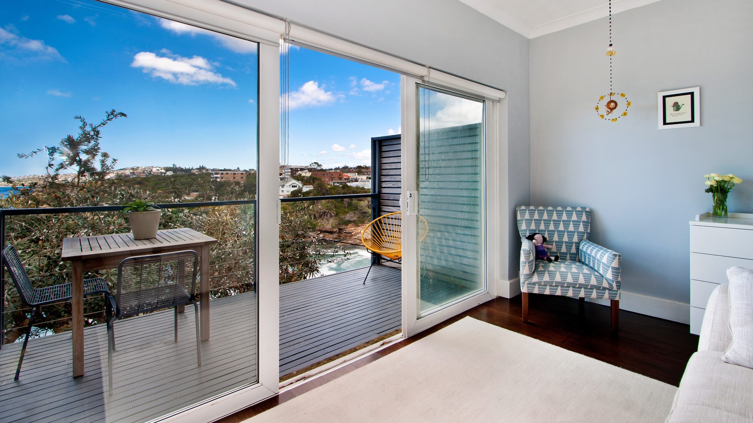 Tasteful living room with sliding glass patio doors leading to a balcony