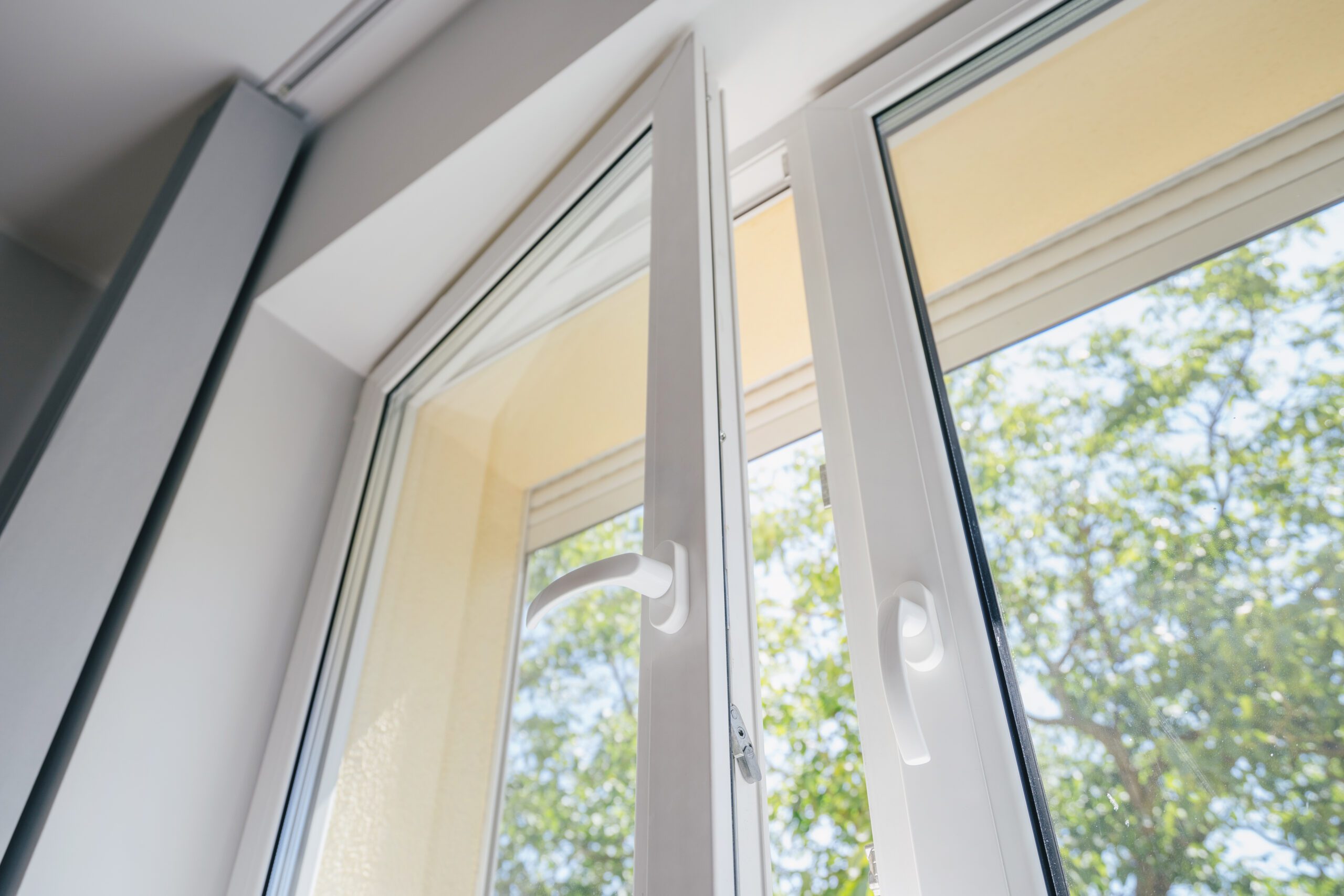 Window with white frame and handles closeup