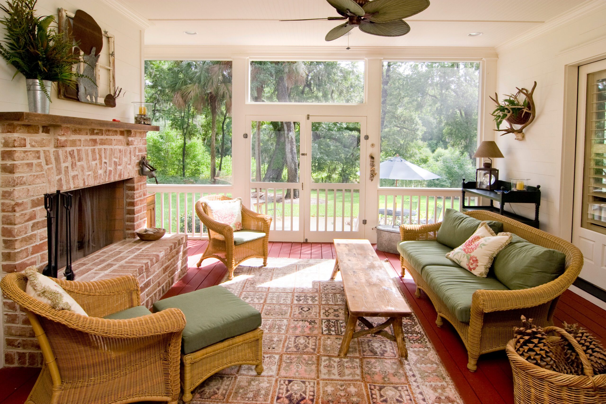 Sunroom with one screen wall and fireplace