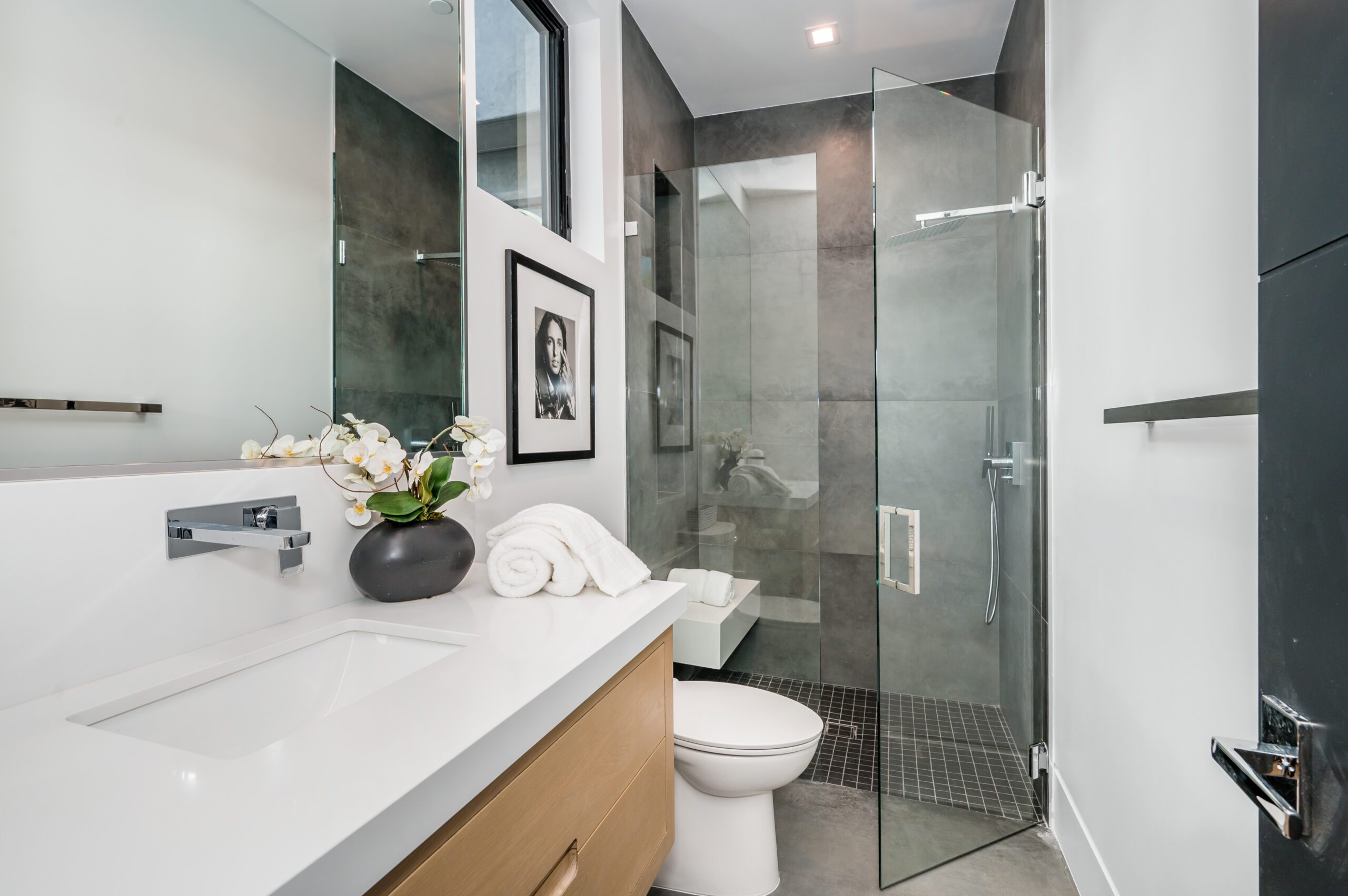 There is a frameless shower door enclosure.