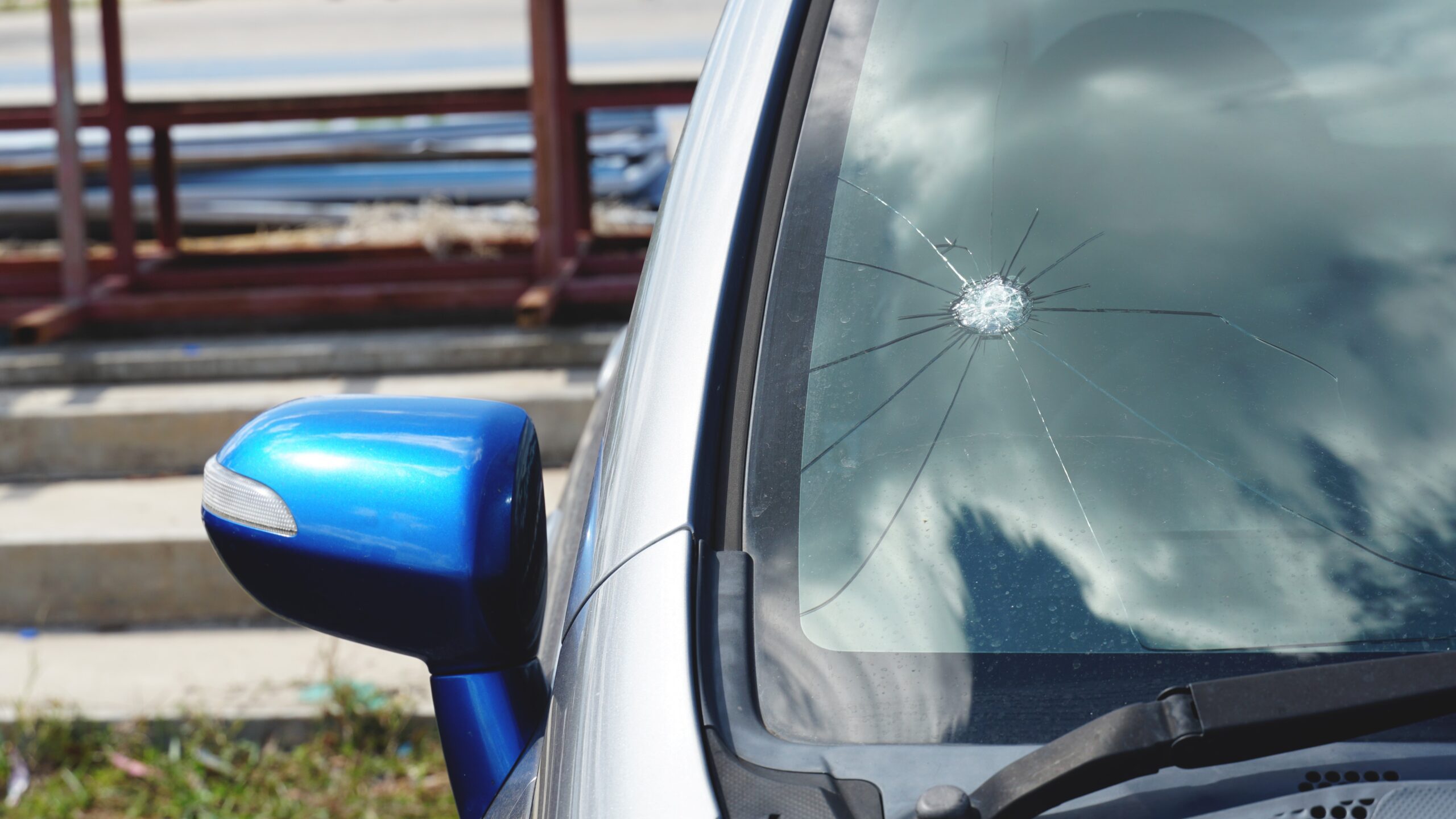 Close-up view of broken car windshield