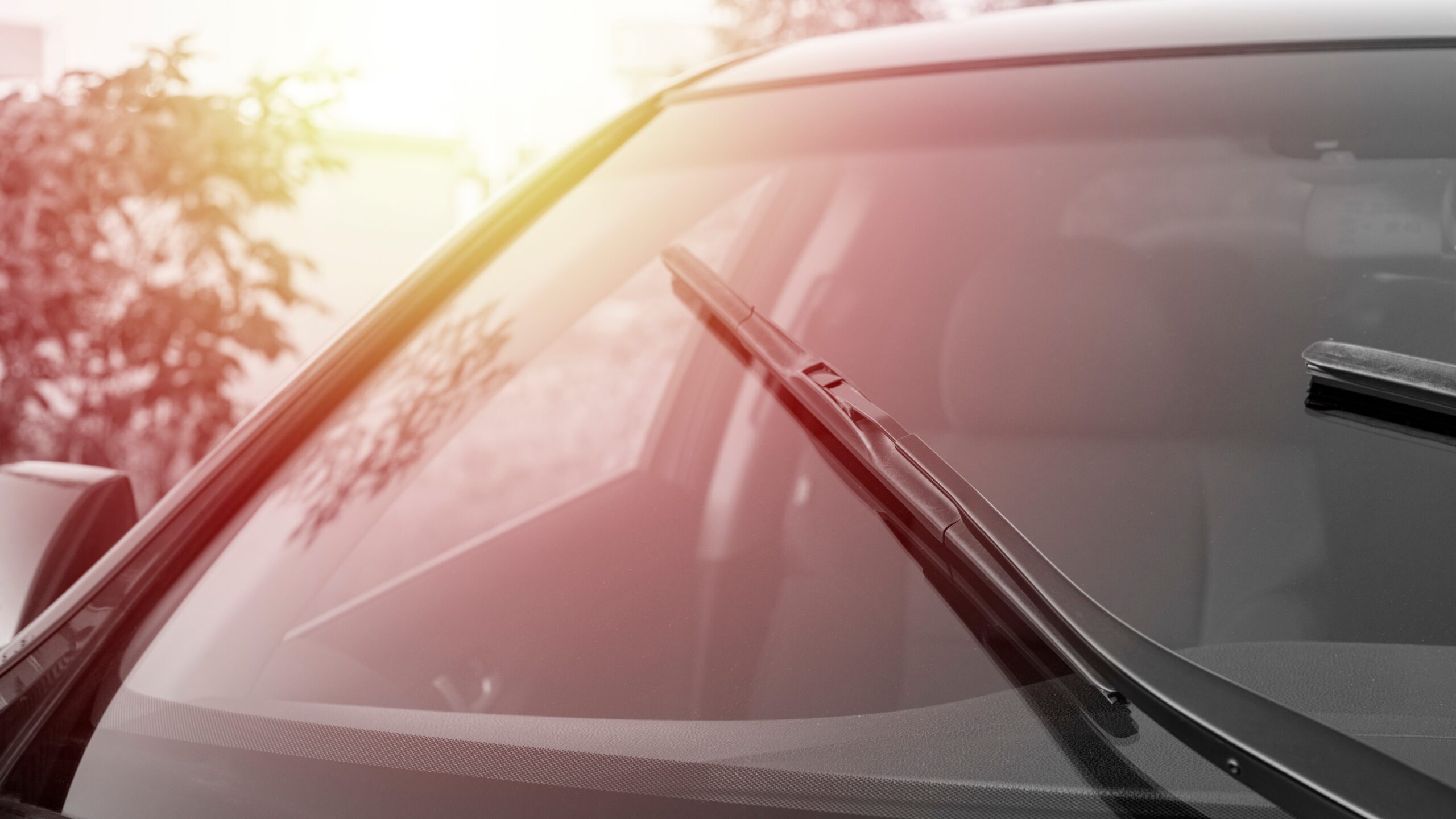 Beautiful new car windshield underneath the sunset